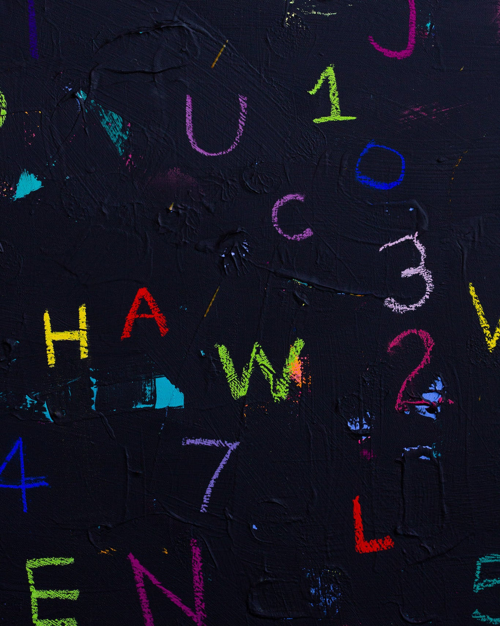 Colorful letters and numbers on a black background