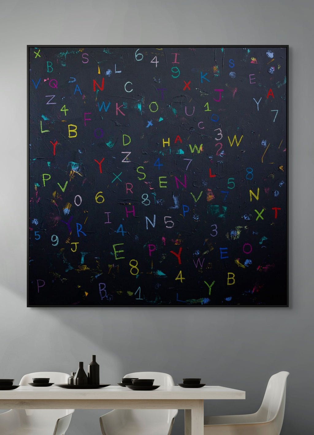 Abstract artwork with colorful letters and numbers on a dark background in a modern dining room.