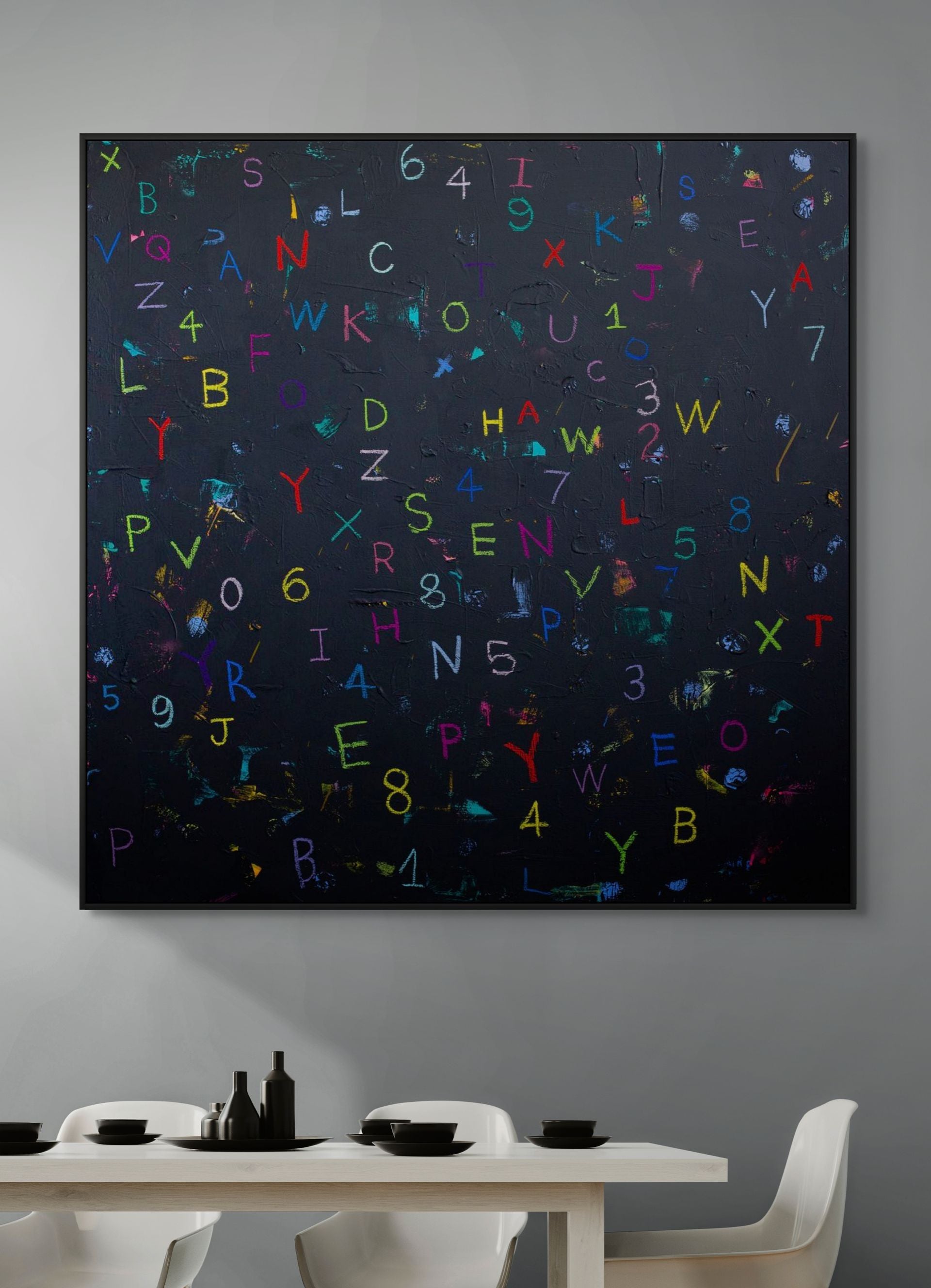 Abstract artwork with colorful letters and numbers on a dark background in a modern dining room.