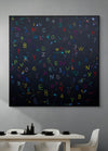 Abstract artwork with colorful letters and numbers on a dark background in a modern dining room.