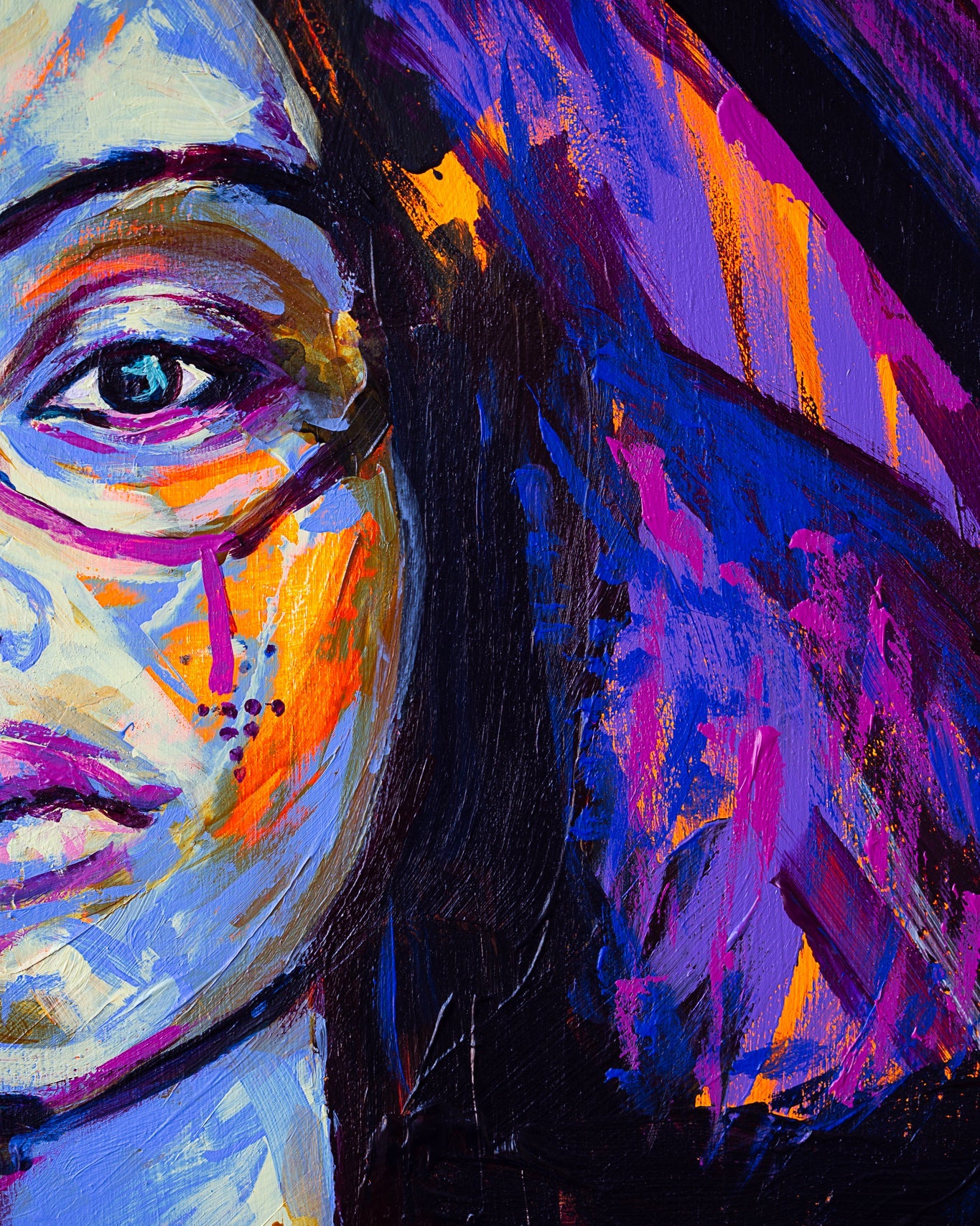 Colorful abstract painting of a face with vibrant hues